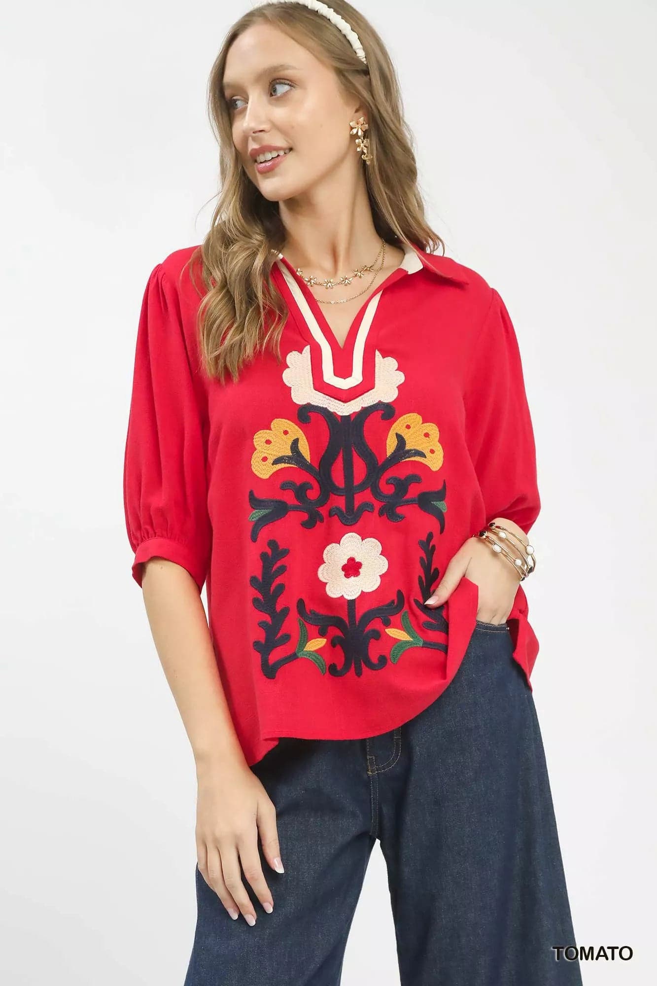Red embroidered tunic top with floral folk design and three-quarter sleeves